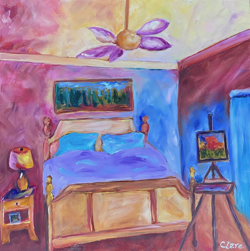 A bedroom with pink, yellow, purple and blue colored walls