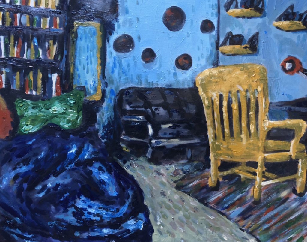A bedroom with a bookshelf and a yellow chair