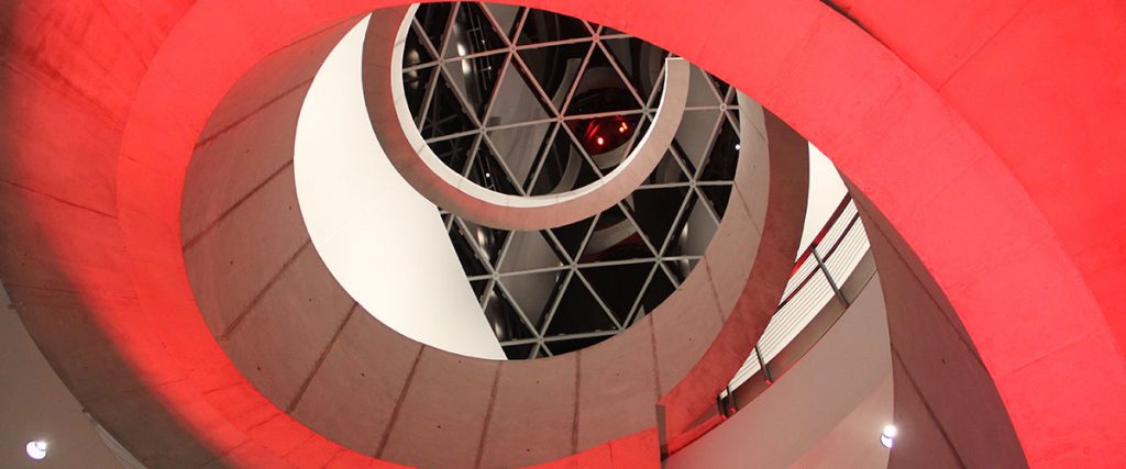 The Dali Museum helical staircase illuminated in red at night