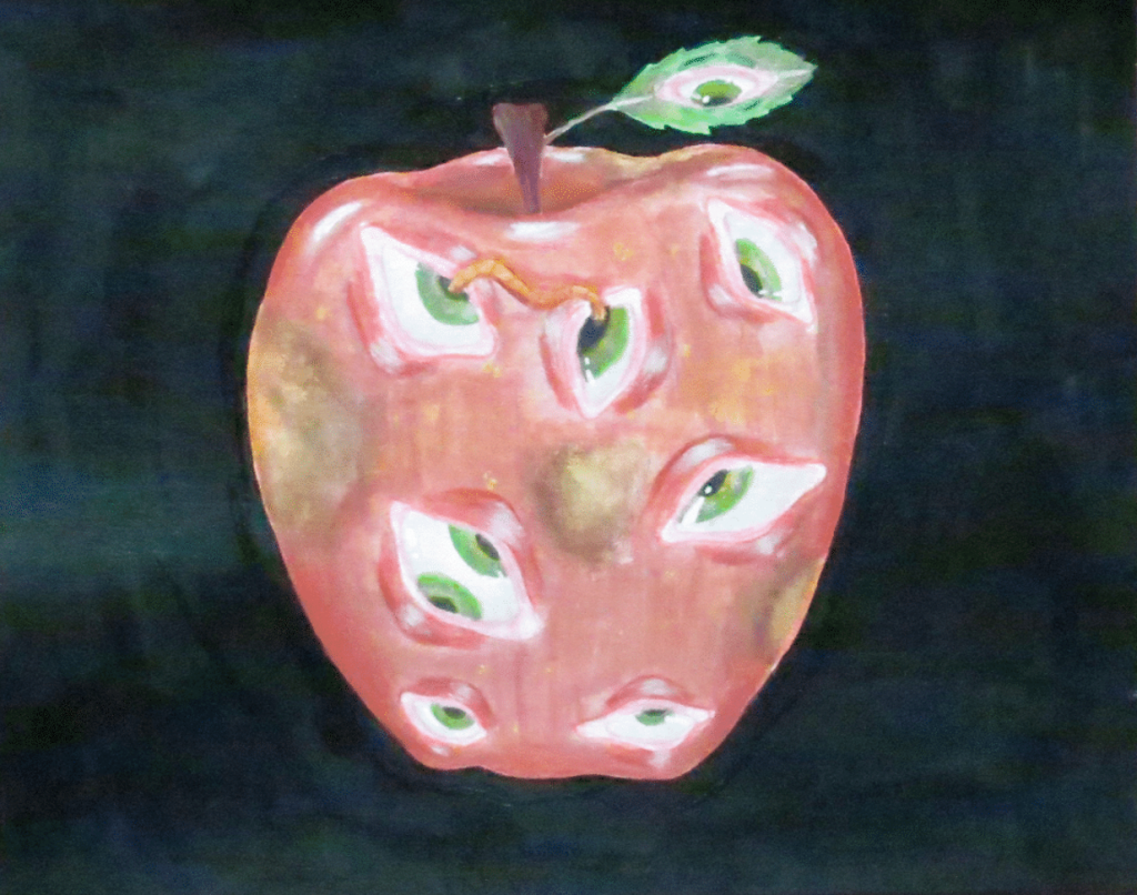 A pink apple with eyes on it