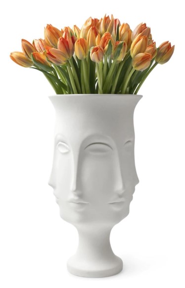 A vase with yellow tulips