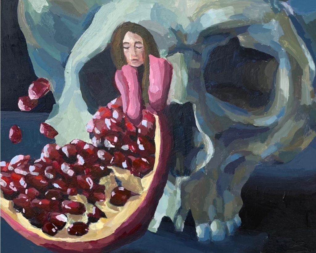 A skull in the background, and a woman in the foreground looking at a pomegranate