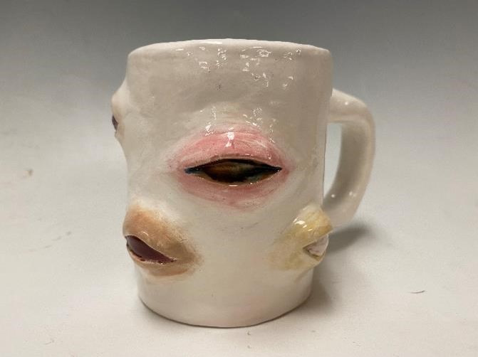 A mug with mouths