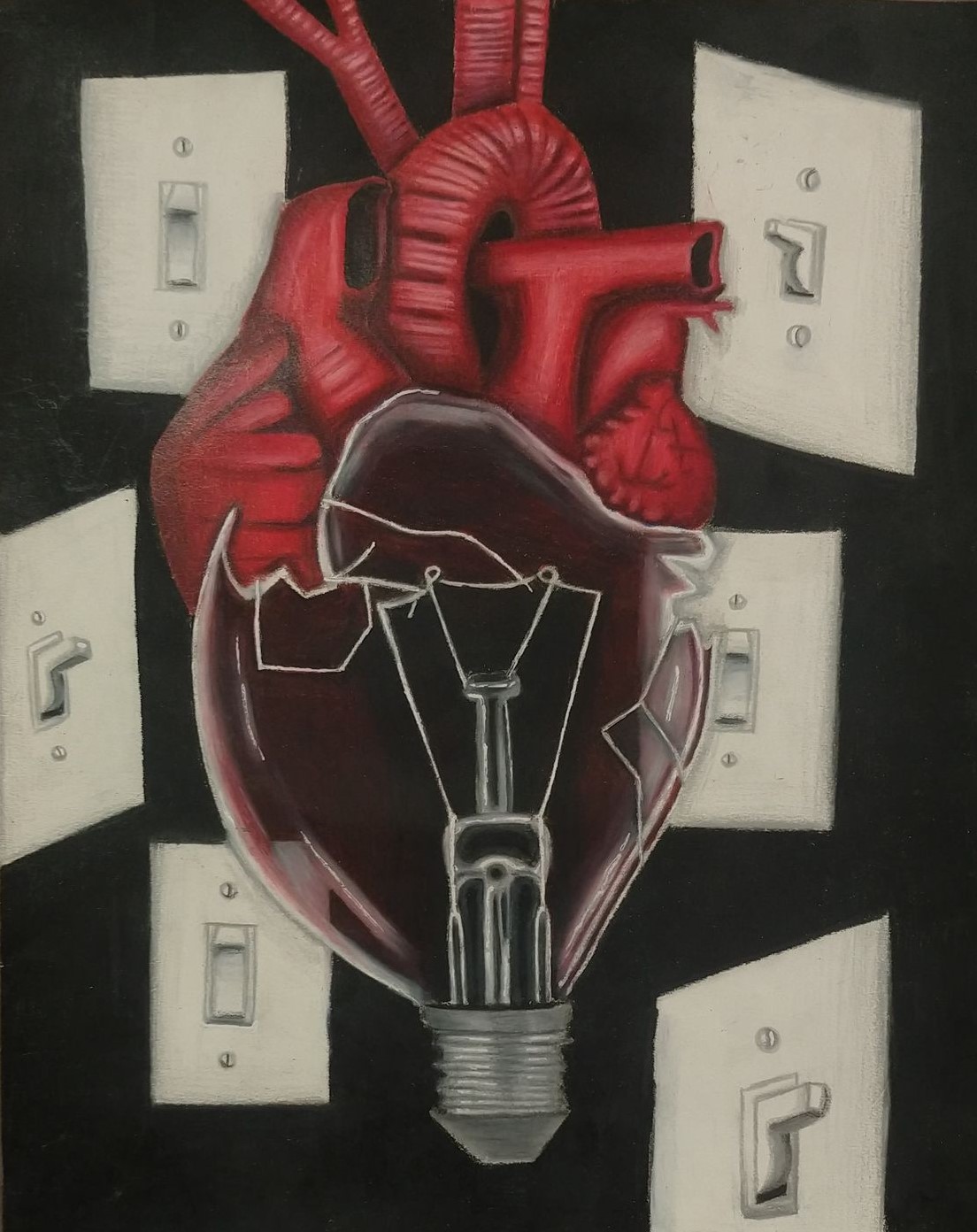 A broken bulb with a human heart on top of it and light switches in the background