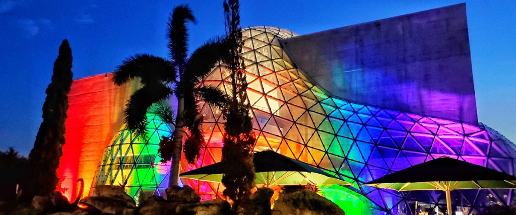 Dali Museum building exterior lit in rainbow colors