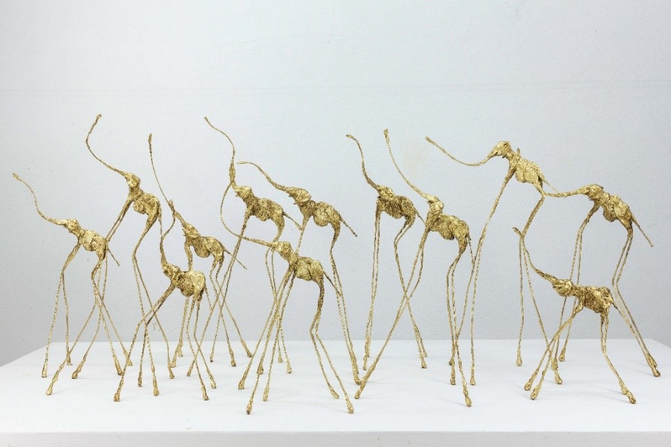 Herd of gold sculptural elephants