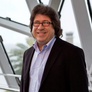 a person in a suit with glasses