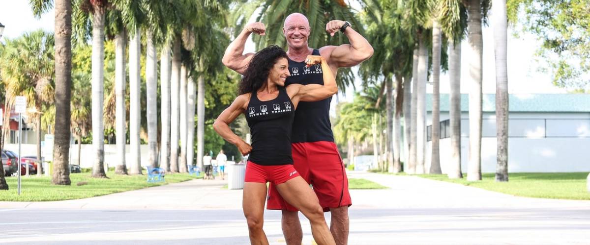 two people flexing their muscles